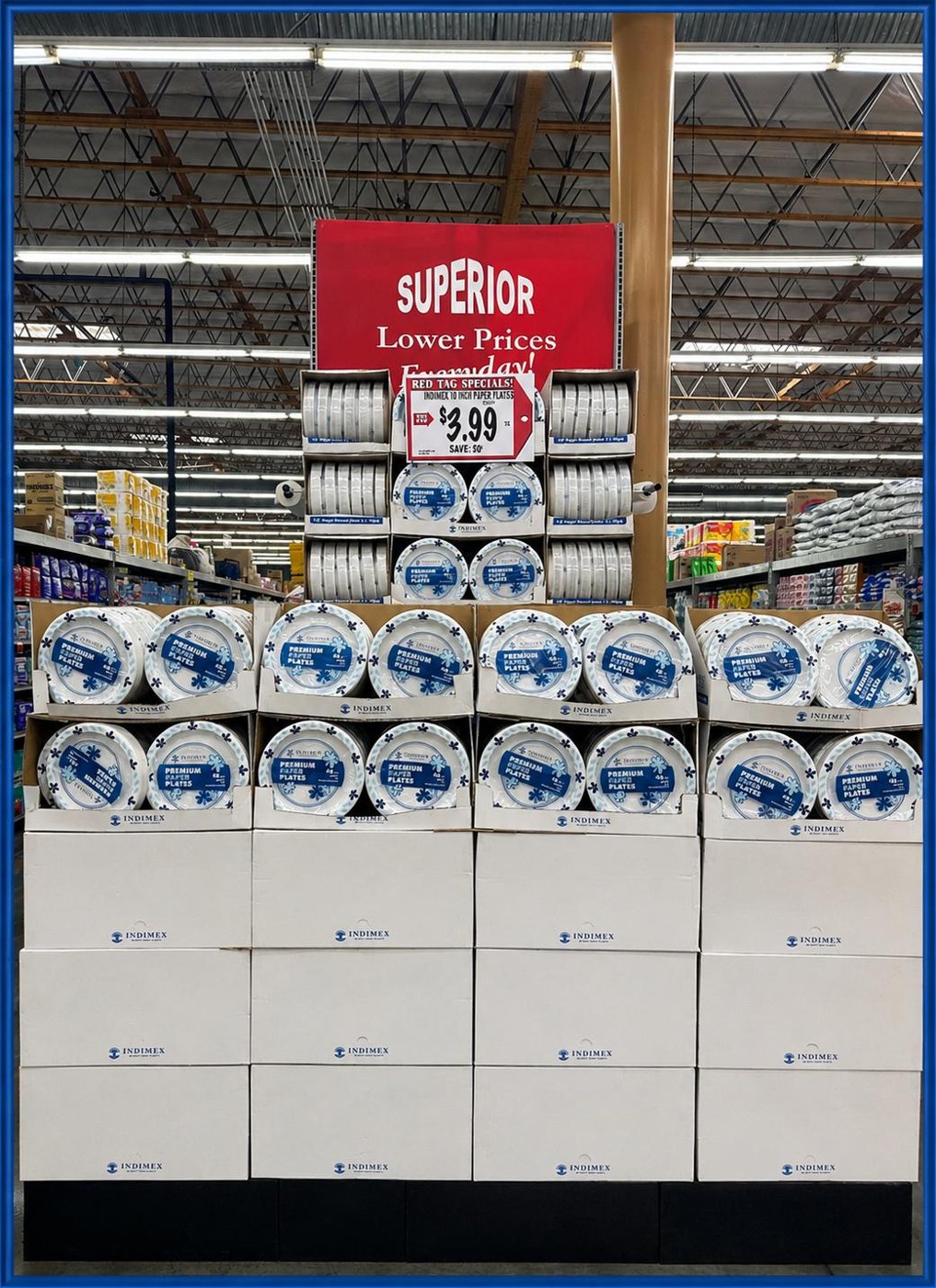 INDIMEX paper plates floor display stack in a grocery store